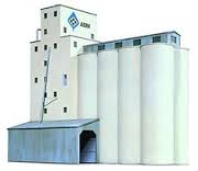 Walthers ADM(R) Concrete Grain Elevator Item # 933-3022. The Walthers Cornerstone HO Scale ADM Concrete Grain Elevator is patterned after modern concrete elevators in use from coast to coast since the 1950s. Grain traffic touches almost every corner of the North American rail network - from the vast cornfields, wheat fields and ethanol plants of the midwest to busy waterfront export terminals, feed mills, food processors and elevators in large cities. Long trains of covered hoppers moving grain and ethanol byproducts such as DDG have become an important part of the railroad landscape. Grain traffic should touch your model railroad too! This detailed kit includes an elevator, eight storage silos, dust bins, head house and sheds for rail and trucks. Full-color ADM logos and billboard sign decal are included. As shown the ADM Concrete Grain Elevator measures: 13-1/2 x 9 x 13-1/2" 33.7 x 23.7 x 33.7cm. Use the ADM Concrete Grain Elevator kit with other Cornerstone industrial buildings.
Typical design used across North America
Eight silos and headhouse
Combine multiple kits to make a larger complex
Use with other Cornerstone grain handling structures
At home on the prairies or in urban or waterfront scenes
Molded in appropriate colors and clear plastic window glazing
Full-color decal signs