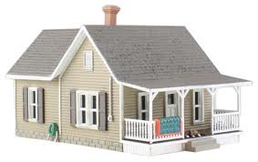 Woodland Scenics Granny's House - HO Scale Item # BR5027. Granny's House is a quaint little home with a rose arbor and Granny's living room rug airing out on the porch. The grandkids are visiting, evidenced by the bikes leaning on the side of the house. The loyal family dog sleeps the afternoon away on the front porch.
This structure comes with pre-installed LED lighting made for use with the Just Plug® Lighting System. 25mA
RoHS Compliant
Colors may vary from actual product.