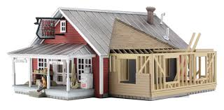 Woodland Scenics Country Store Expansion - HO Scale Item # BR5031. Business is booming on your layout with this Built-&-Ready® structure. The local country store is expanding, and construction of its addition is well underway. Details include weathered clapboard siding, a metal roof, screen doors, an ice machine, signage, a staircase to the upper floor and more! See photos for footprint.
This structure comes with pre-installed LED lighting made for use with the Just Plug® Lighting System. 25mA
RoHS Compliant
Colors may vary from actual product.