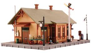 Woodland Station - HO Scale Kit. Item # PF5187. Model the center of passenger train activity. Porters scurry about carting and loading luggage and assist passengers with boarding, while the conductor coordinates the crew's activities and reviews schedules and switching orders. Paint this vintage and versatile train depot to match your layout scene. See photos for footprint.
Vehicle and landscape sold separately. Click Contents for list of included materials.
Colors may vary from actual product.