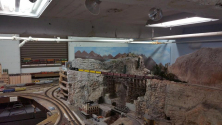 The PikeMasters Railroad Club, Was founded in 1988, currently is the only model railroad club operating a permanent layout in Colorado Springs CO, United State. The PikeMasters have been in the City Auditorium site since 1996. The current facility at one time housed the Colorado Springs Police Department indoor pistol firing range. For more model Train Clubs visit www.krafttrains.com. The PikeMasters layout covers the periods from early steam through modern diesel power. Both standard gauge and narrow gauge trains are modeled. The standard gauge trains are operating on the popular HO model railroad scale. The prototype is the ever- present four feet 8.5 inch wide tracks found throughout Colorado Springs and the United States. The narrow gauge section operates on the HOn3 scale. This narrow gauge scale has the prototype track that was three feet wide and was common during the late nineteen and early twentieth century Rocky Mountain region. The Durango-Silverton, Cumbres and Toltec and the Georgetown Loop lines still operate a three-foot wide rail.