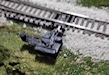 Download the .stl file and 3D Print your own Turnout Machine HO scale model for your model train set.