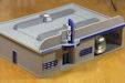 Download the .stl file and 3D Print your own Bus Station HO scale model for your model train set.