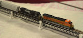 Download the .stl file and 3D Print your own Steel Truss Bridge N scale model for your model train set.