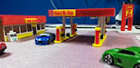 Download the .stl file and 3D Print your own Gas Station N scale model for your model train set.