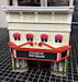 Download the .stl file and 3D Print your own Cinema Storefront O scale model for your model train set.