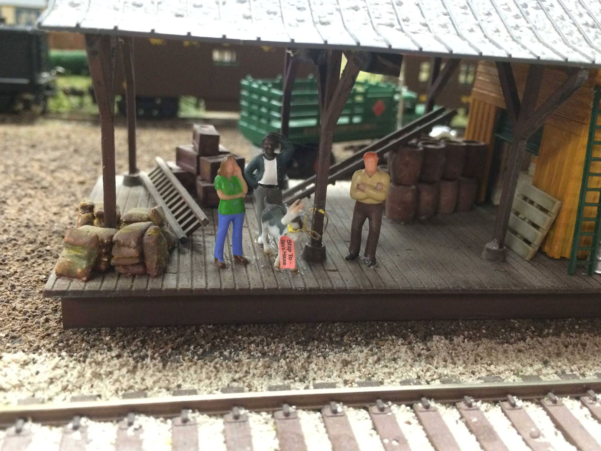 Miniature loading dock with figures and cargo at Oshawa Pine Ridge Model Railroaders Club.