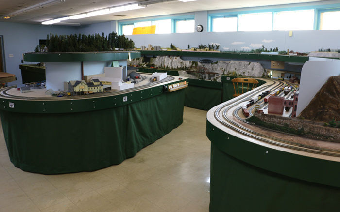 Overview of the Pine Ridge Model Railroaders Club model train layout, showcasing tracks, buildings, and landscapes.
