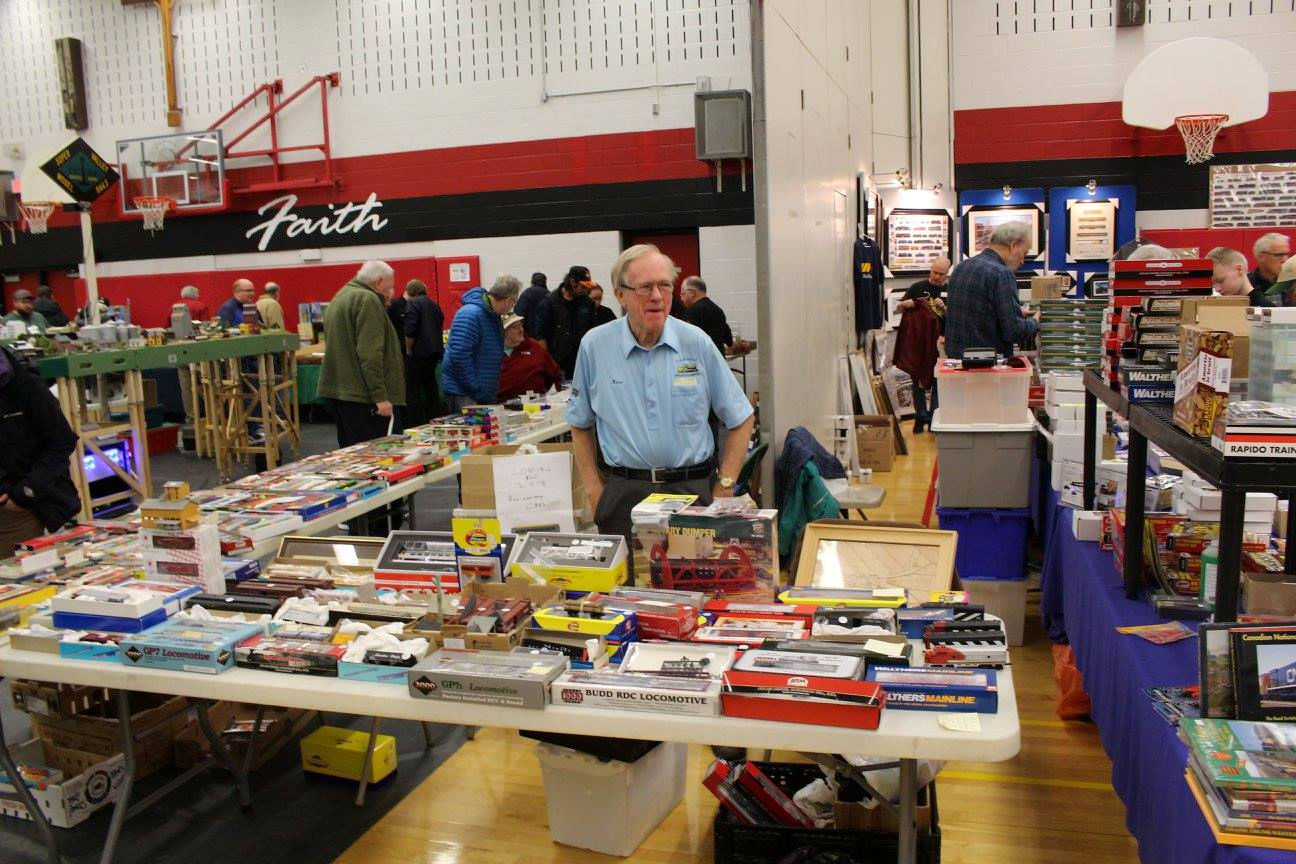 Vendor selling model train kits, locomotives, and accessories at the Pine Ridge Model Railroaders Club event.