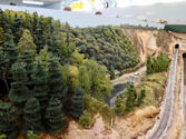 A freight train carrying cargo through an industrial area.