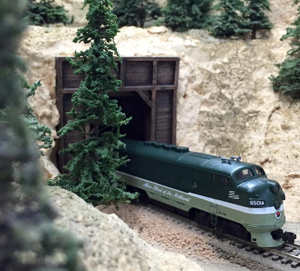 Welcome to the Los Angeles N-Scale Association, operators of East Valley Lines Model Railroad club located since 1979 in the Travel Town Museum at Griffith Los Angeles, California. View pitchers of the East Valley Lines N Scale Model Railroad club and see what they have done to their N scale layout. They operate one of the largest N-Scale layouts in the world. This is just a brief trip on the East Valley Lines' trackage. As you observe closely, there are lots of details to enjoy. This is truly a labor of love, involving countless hours, money and the talents of the many N-Scale modelers dedicated to the memory of great railroads. Brought to you to by www.krafttrains.com
