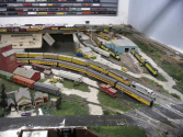 The PikeMasters Railroad Club, Was founded in 1988, currently is the only model railroad club operating a permanent layout in Colorado Springs CO, United State. The PikeMasters have been in the City Auditorium site since 1996. The current facility at one time housed the Colorado Springs Police Department indoor pistol firing range. For more model Train Clubs visit www.krafttrains.com. The PikeMasters layout covers the periods from early steam through modern diesel power. Both standard gauge and narrow gauge trains are modeled. The standard gauge trains are operating on the popular HO model railroad scale. The prototype is the ever- present four feet 8.5 inch wide tracks found throughout Colorado Springs and the United States. The narrow gauge section operates on the HOn3 scale. This narrow gauge scale has the prototype track that was three feet wide and was common during the late nineteen and early twentieth century Rocky Mountain region. The Durango-Silverton, Cumbres and Toltec and the Georgetown Loop lines still operate a three-foot wide rail.